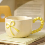 320Ml/10.82Fl.Oz. Cream Bowknot Ceramic Cup (Beige)